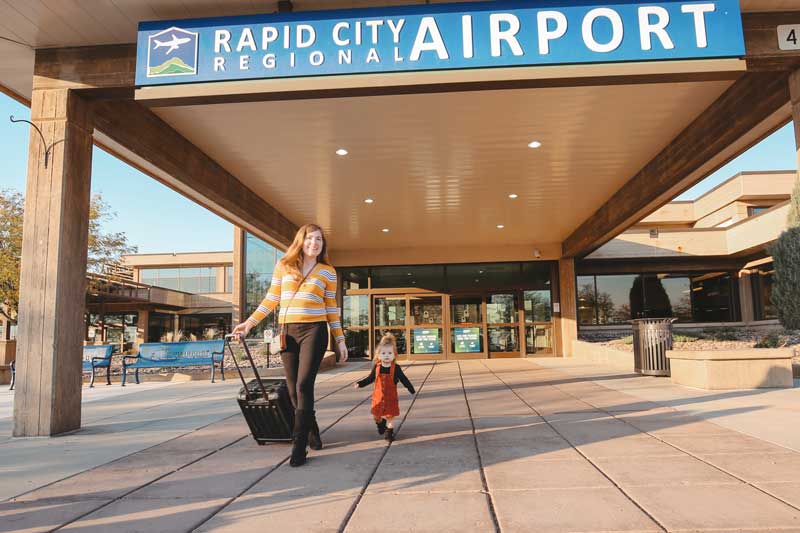 Rapid City Regional Airport terminal woman traveling with a child